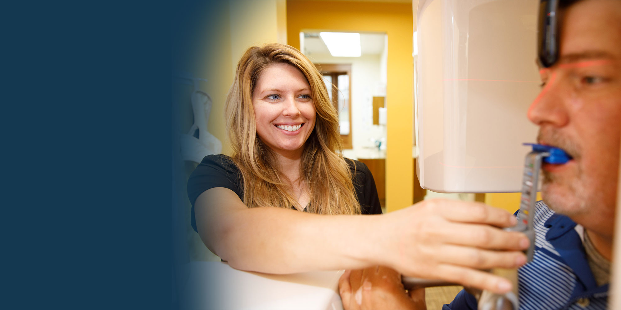 staff member taking a x-ray of patient